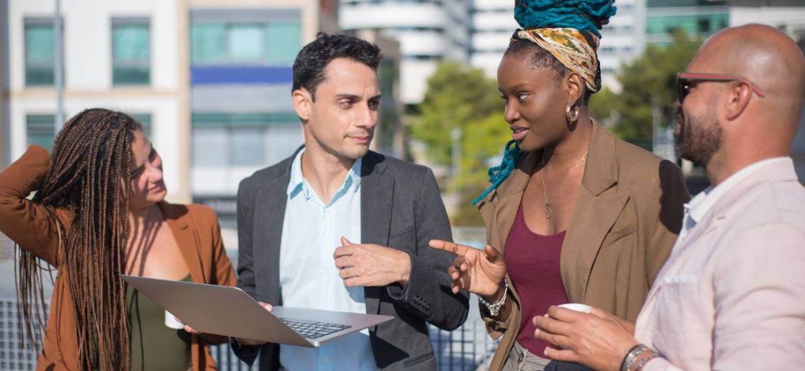 smart-dressed-business-people-discussing-matters-terrace-roof-men-women-different-nationalities-terrace-roof-using-laptop-work-modern-technology-team-concept