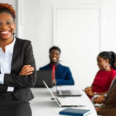 Businesswoman leading accredited corporate training session for B-BBEE skills development compliance in South Africa