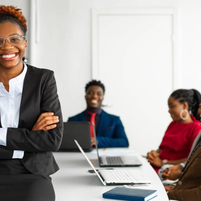 Businesswoman leading accredited corporate training session for B-BBEE skills development compliance in South Africa